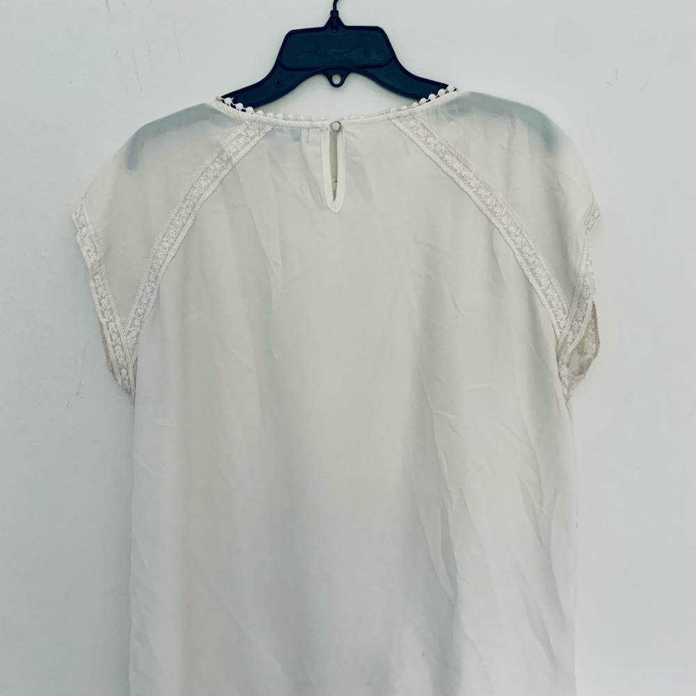 Faith and joy cream blouse with lace detail.